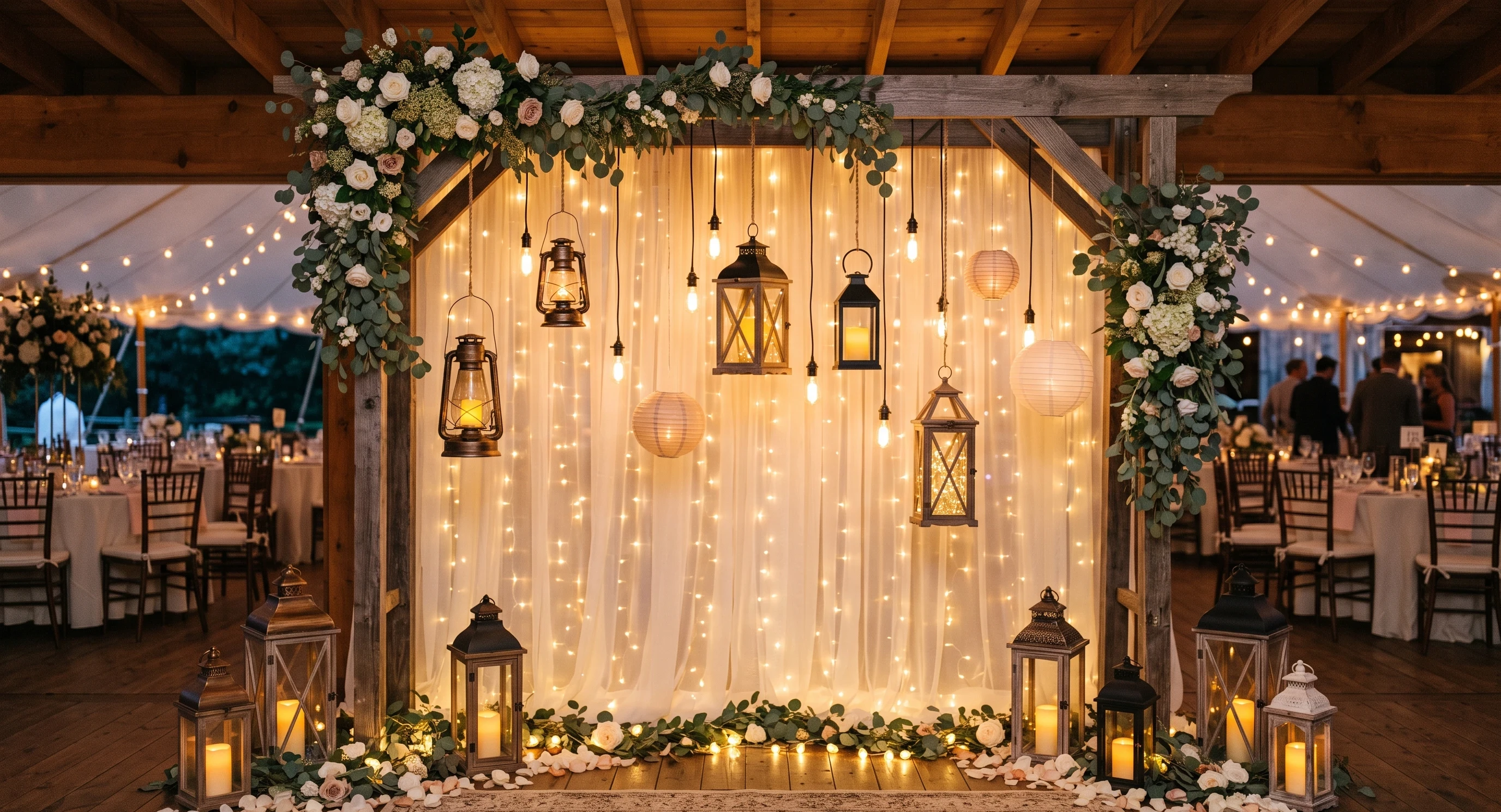 Wedding backdrop with hanging lanterns and warm string lights