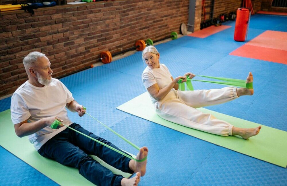 A Couple Exercising with Resistance Bands