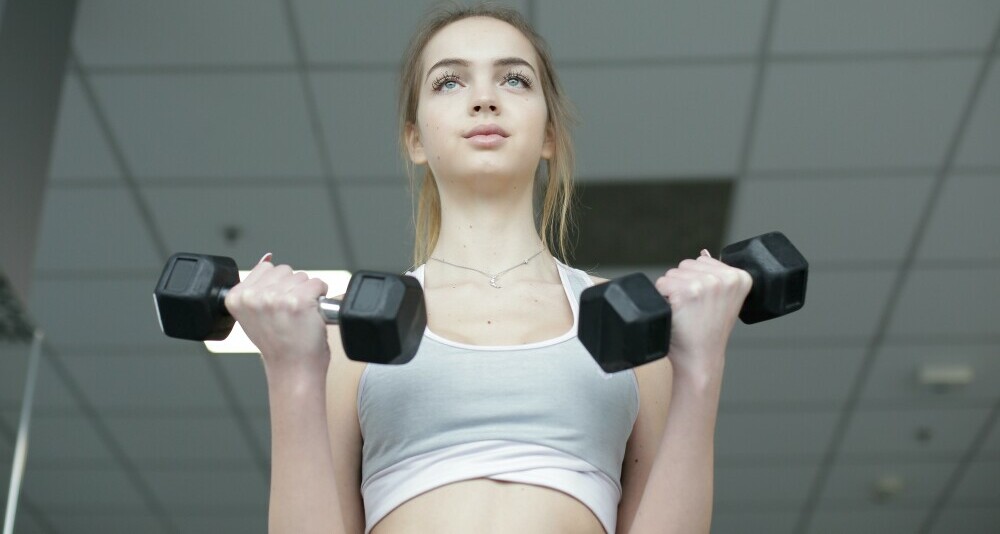 Woman Lifting Dumbbells