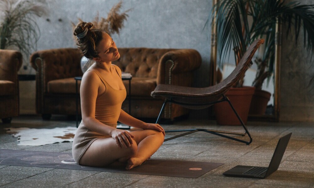 Person relaxing after a workout at home 