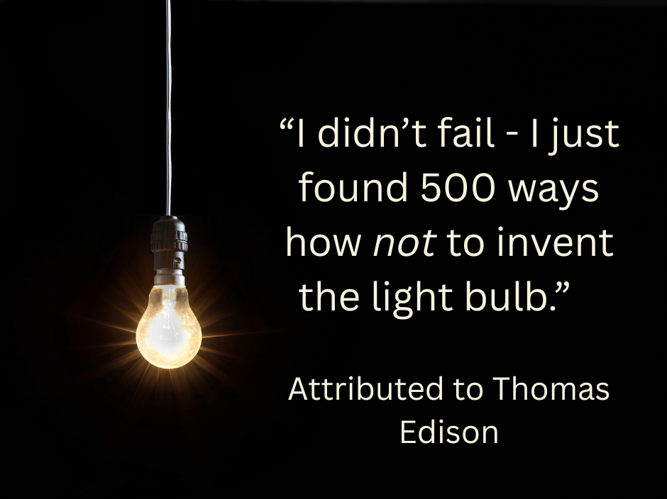 A single light bulb shown on a black background with text ovelay