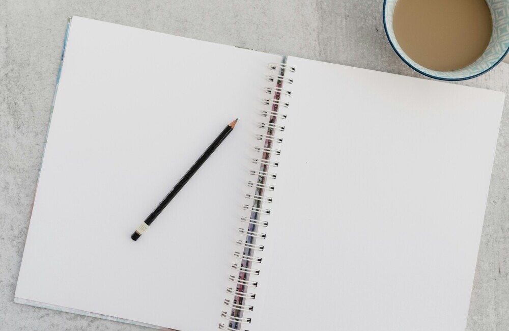 an open, blank notebook