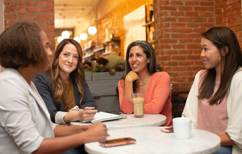 people chatting over a coffee