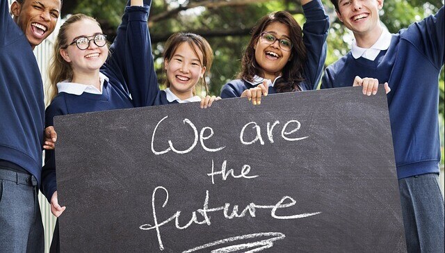 Why Drama Should Be Included In School Curriculums - children with sign saying