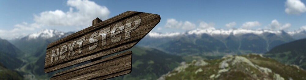 sign saying 'next step'