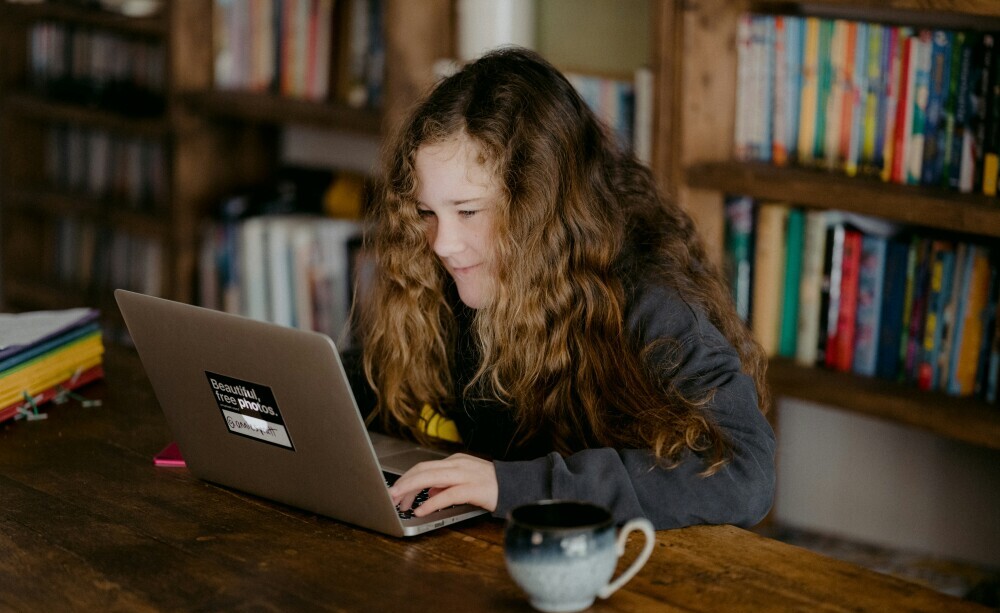 GCSE Drama Revision Plan Template - girl using a computer