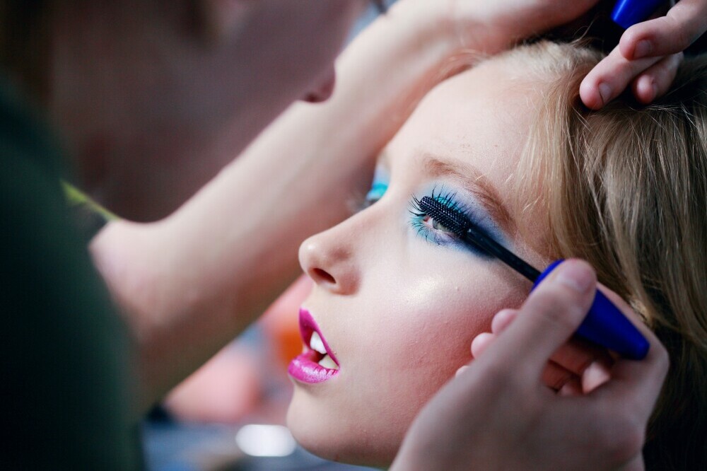 girl having stage make-up done