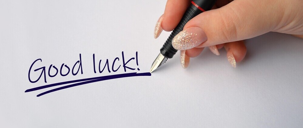 hand writing 'good luck'