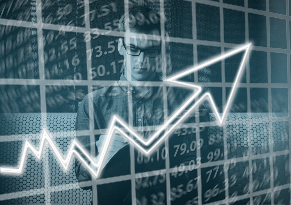A man surrounded by numbers and an arrow representing growth