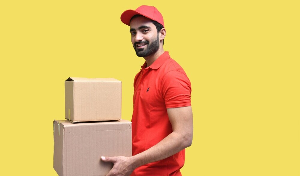 An Amazon prime delivery man collected boxes and getting ready to deliver