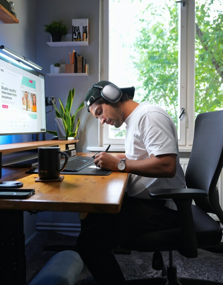 A focused content creator working with a timer, making decisions quickly and staying productive