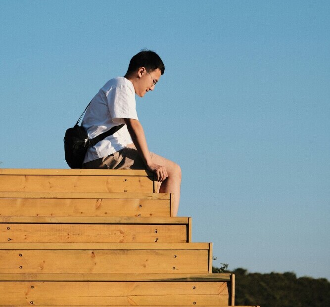 A person waiting for motivation versus another starting work immediately, showing action leading to momentum