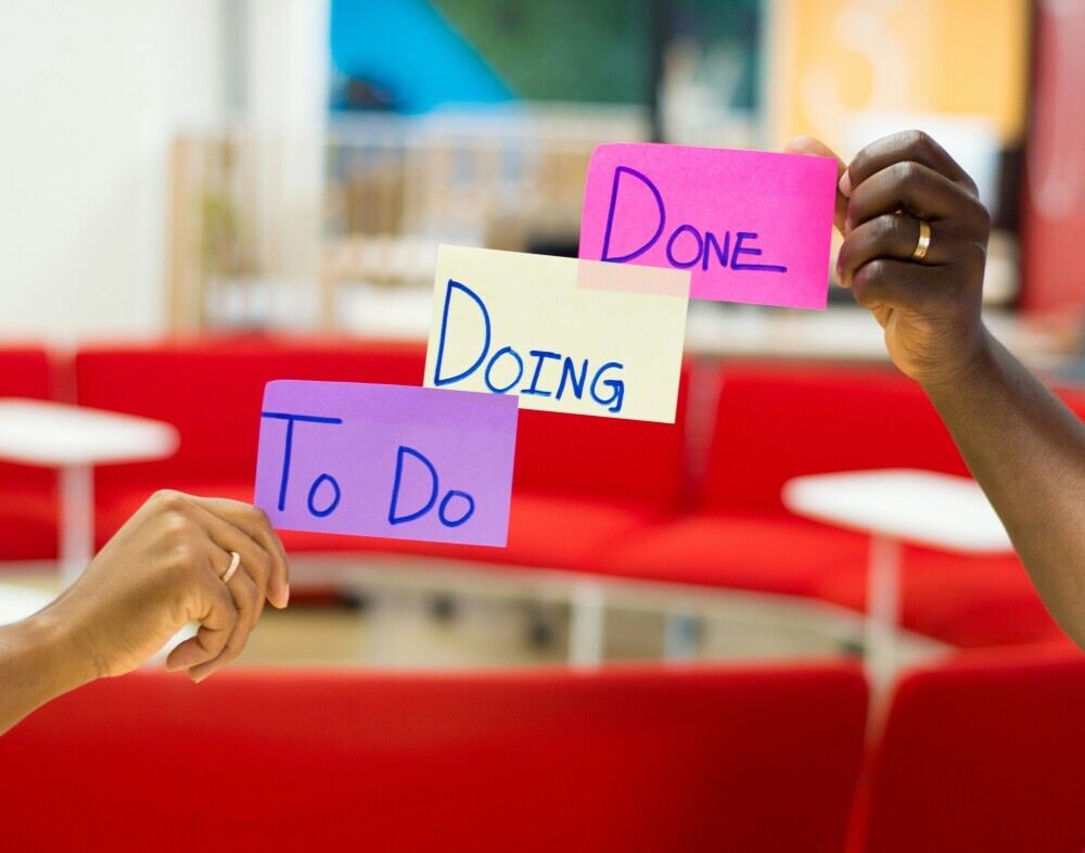 A person switching between multiple tasks versus another focusing on one task, showing the power of staying committed