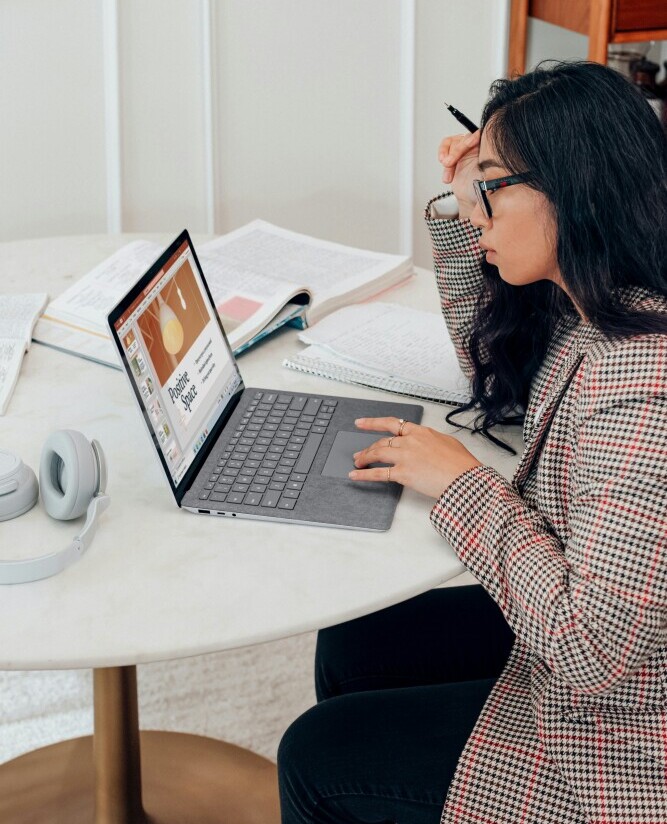 A content creator reviewing and updating a task list, staying organized and focused on progress