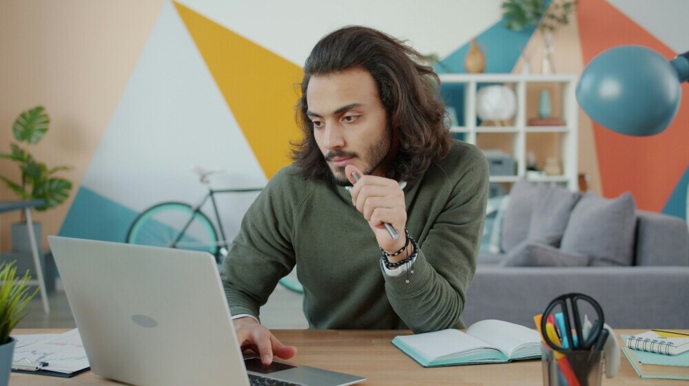 Affiliate marketer building momentum through consistent daily work, showing steady progress on a laptop in a focused environment