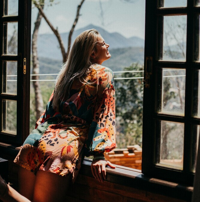 A woman relexing and enjoying freedom of success.