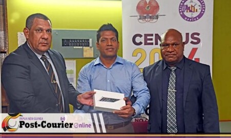Screenshot of Richard Masere, MP presenting 22 throusand tablets to the PNG Cencus Board.