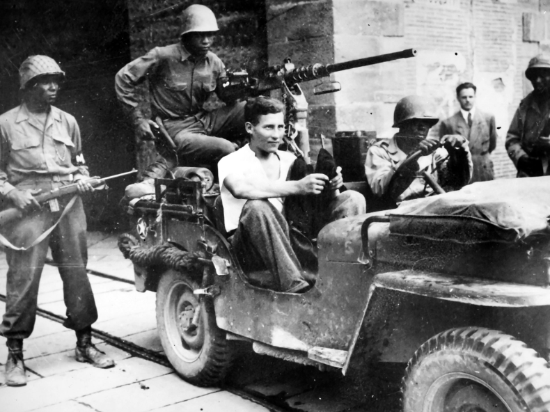 Buffalo Soldiers of the 92nd ID capture a German soldier in Lucca, Italy