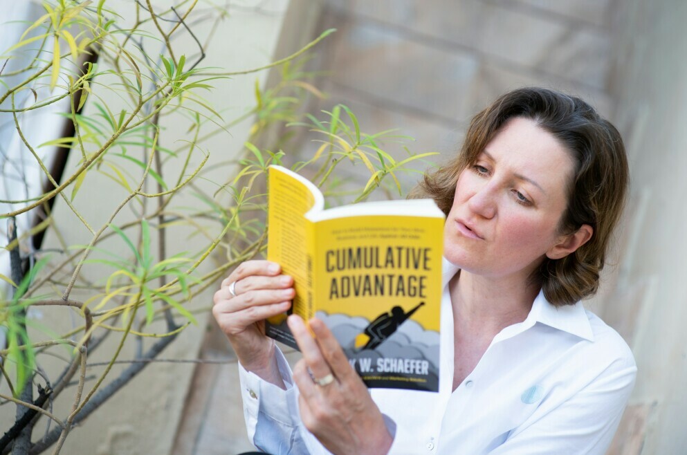 woman with growth mindset reading book 