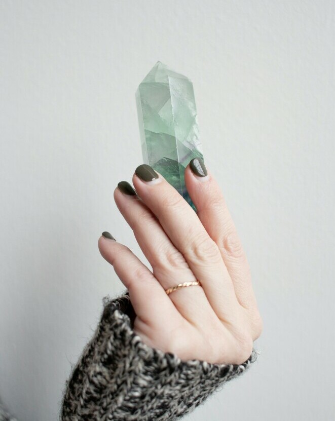 woman holding a crystal