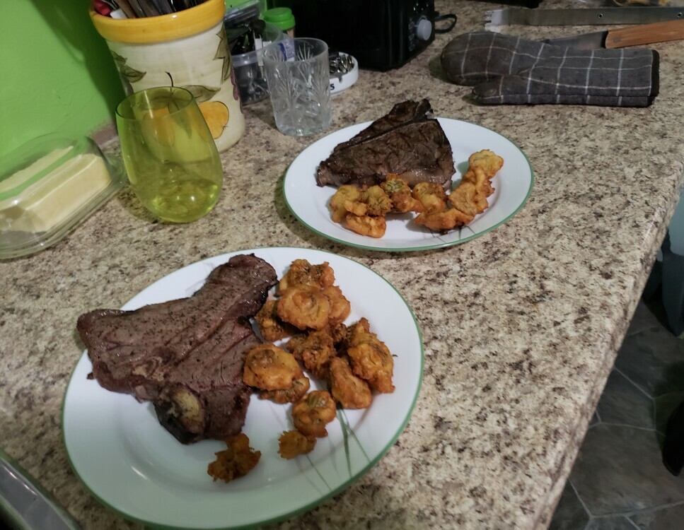 T-bone steak with dandelion flower fritters on the side