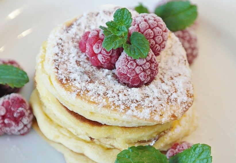 stack of pancakes with powdered, sugar coating