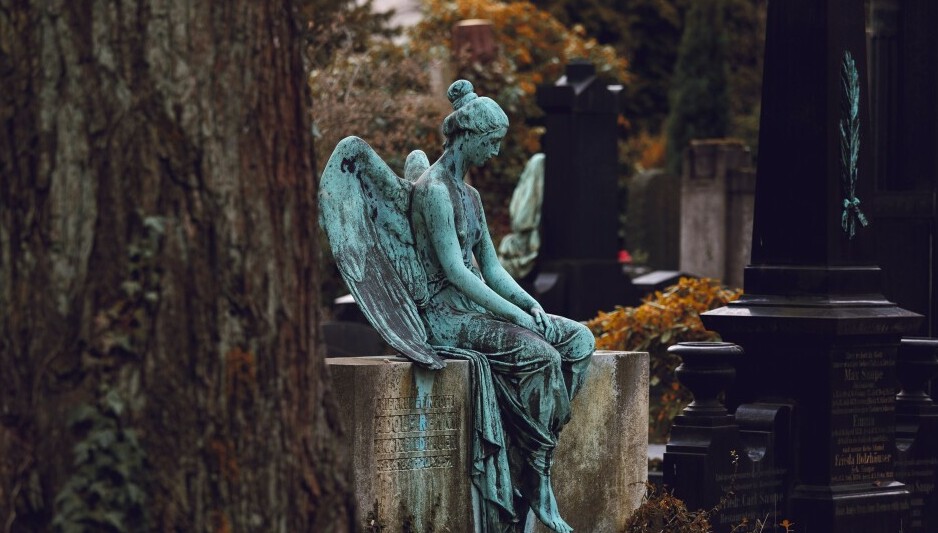 statue of an angel in a cemetary