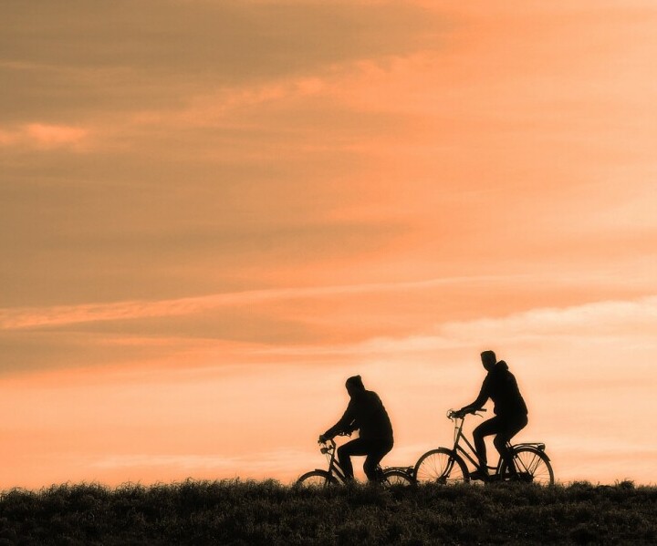 two people bicycling 