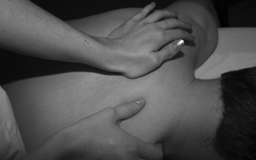 Man getting back massage to treat  chronic back pain