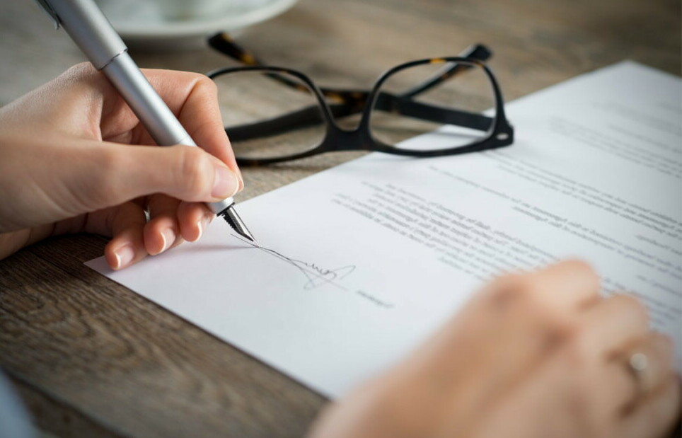 Lawyer signing a document