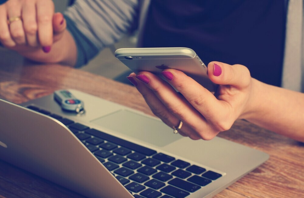 woman receiving message on her phone