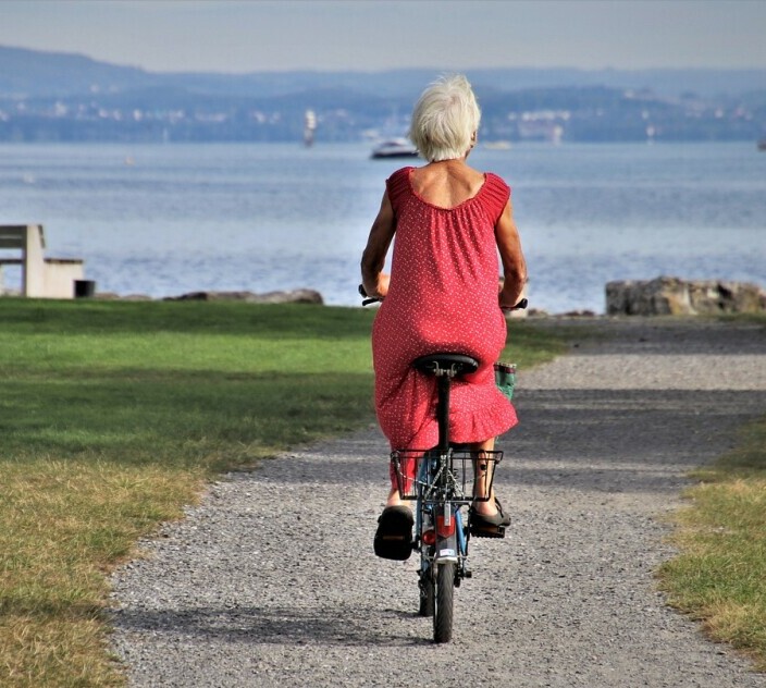 healthy senior woman out bicycling