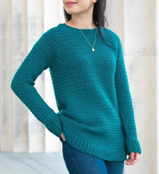 Explore a FREE beginner-friendly crochet sweater pattern, showcasing a simple yet elegant design perfect for those new to the craft and looking to create a cozy winter garment. Click to learn more!