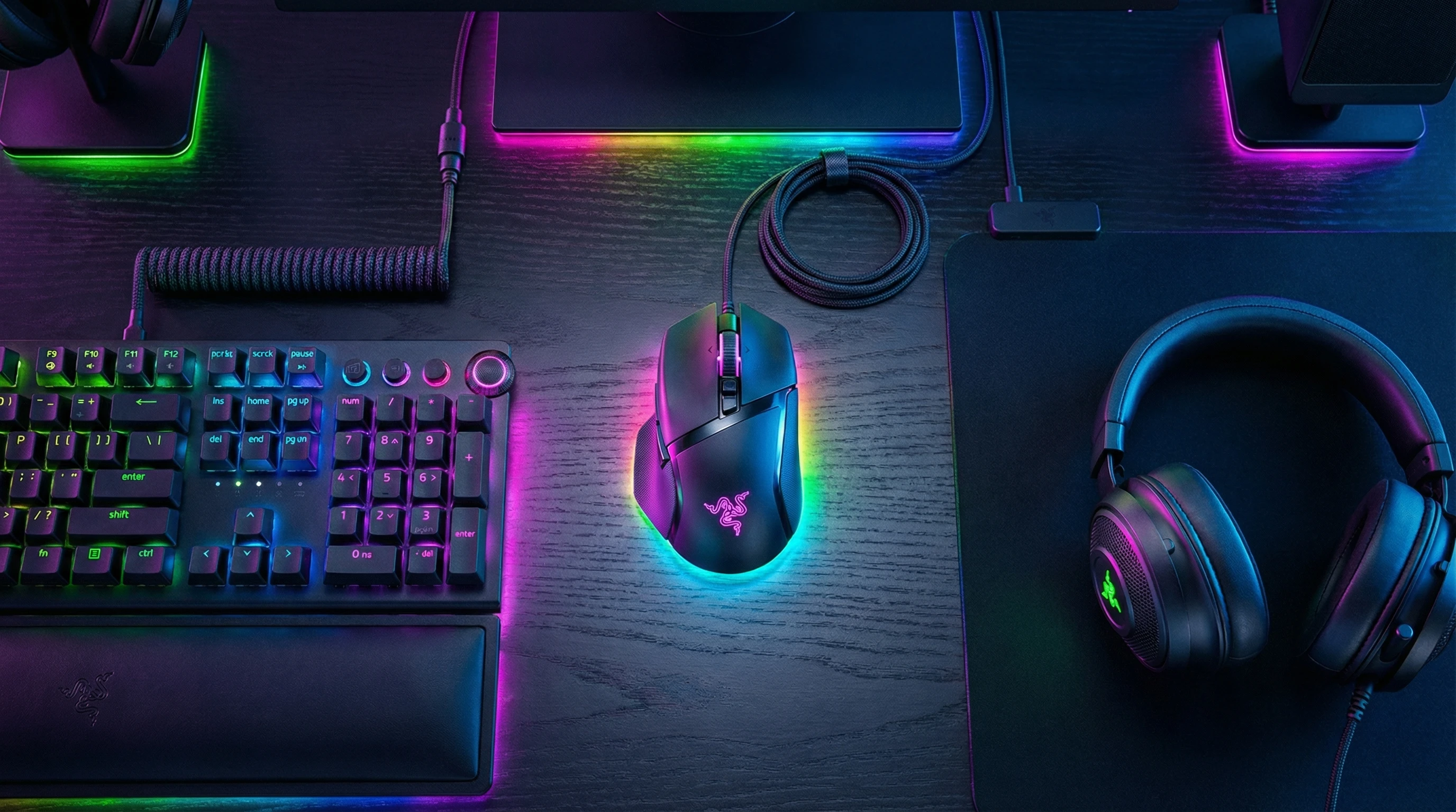 Razer Basilisk V3 Pro gaming mouse on desk with RGB lighting
