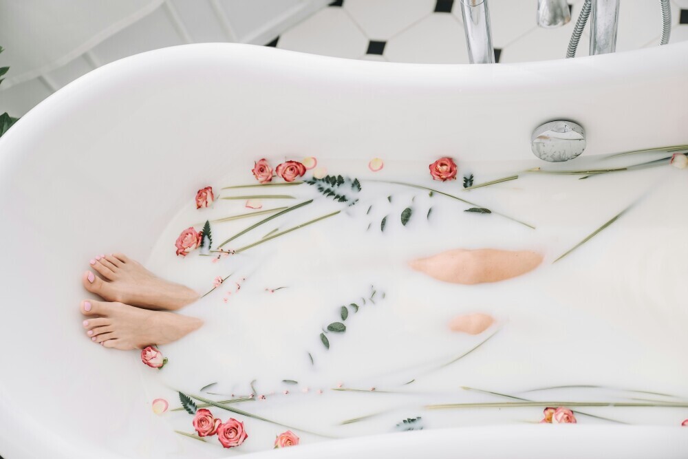 Relaxing self care bath routine with essential oils and body care products