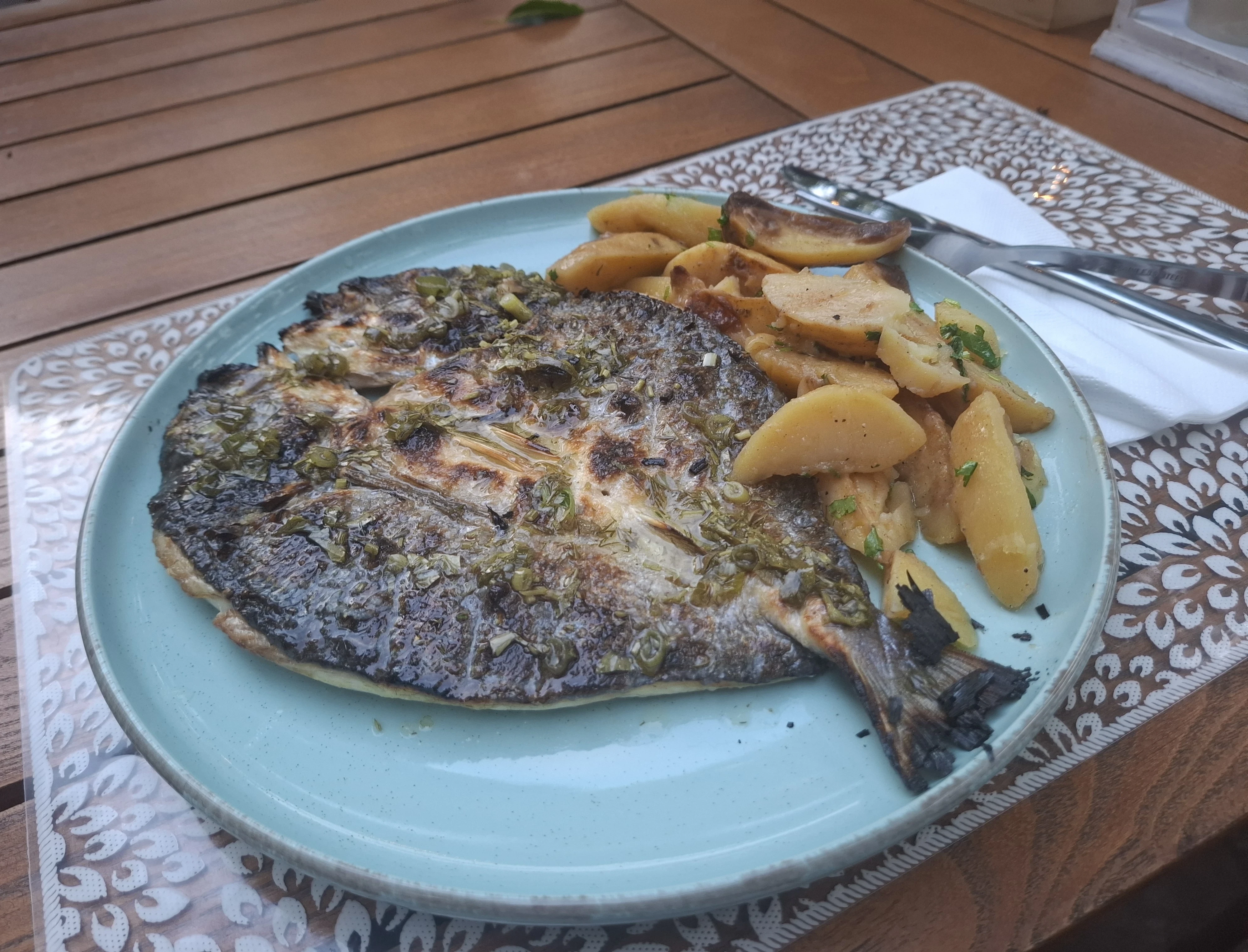 Grilled Sea Bream and Potatoes at pub restaurant in Plovdiv Old Town 