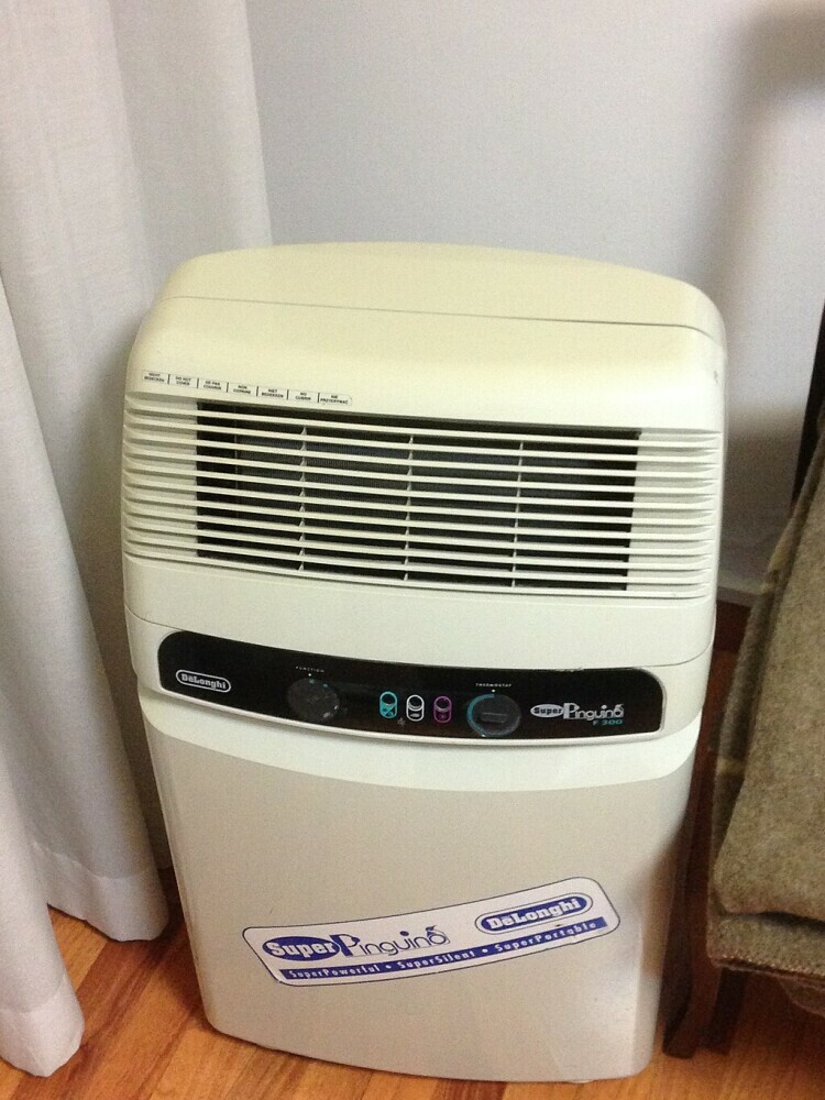 An example of a portable air conditioner, which is convenient but not very effective if the hot air is not leaving the cool room