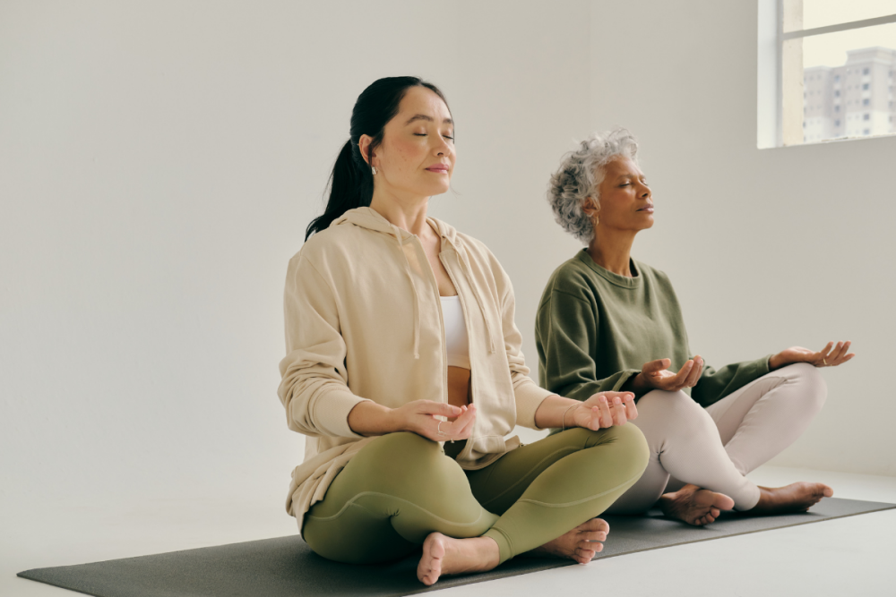 Two women meditating