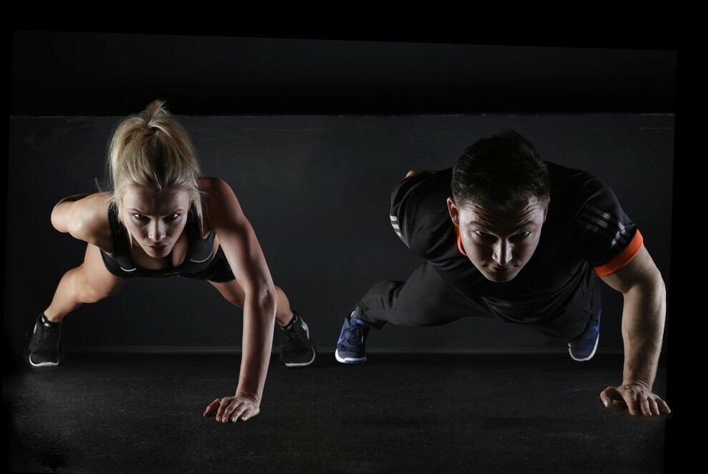 man and woman doing strength training