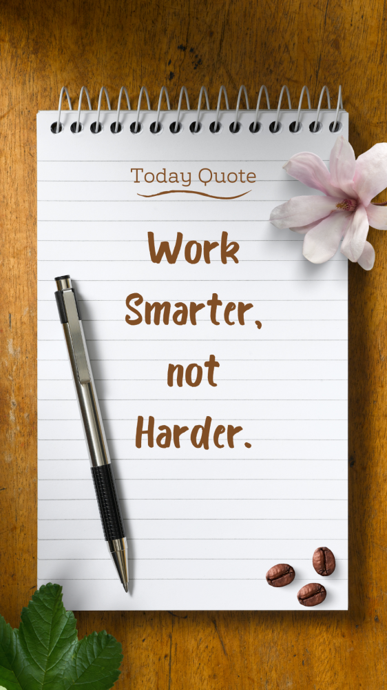 Text reading: Todays quote. Work Smarter not harder. This is written on a white page of a notebook. There is a pen resting on it. There is a pink flower above