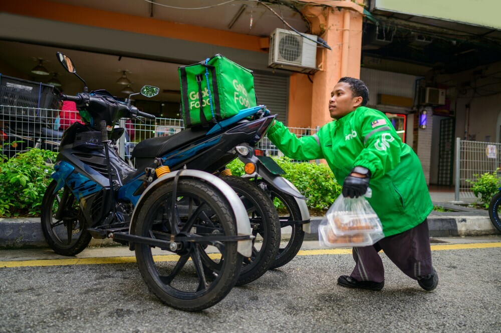 disabled person working as a food delivery driver