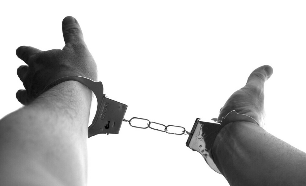 handcuffs on hands