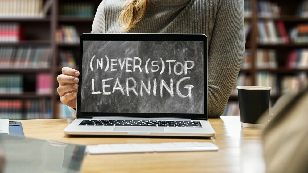 never stop learning sign on laptop