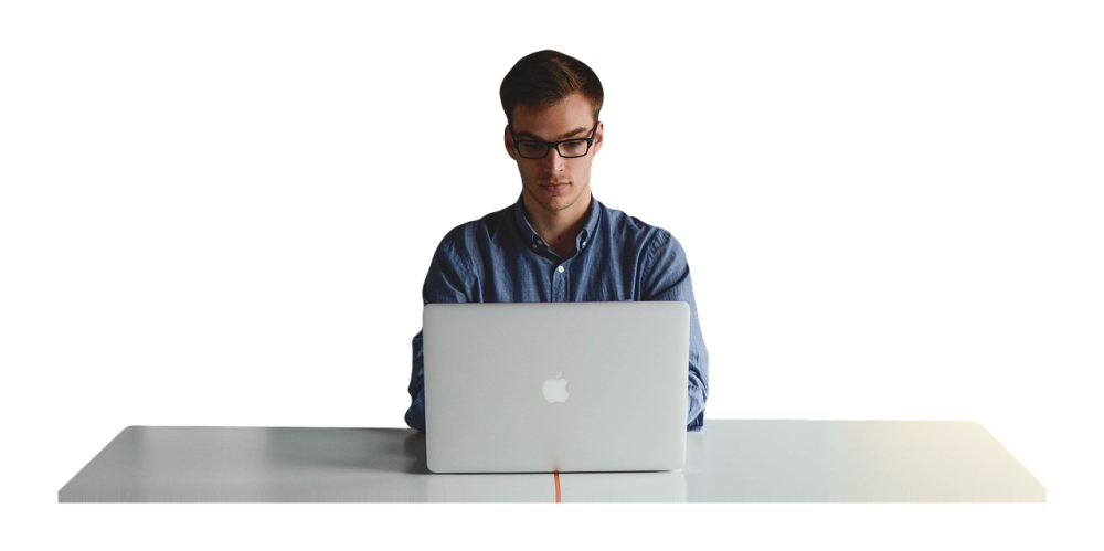 man writing on desktoop