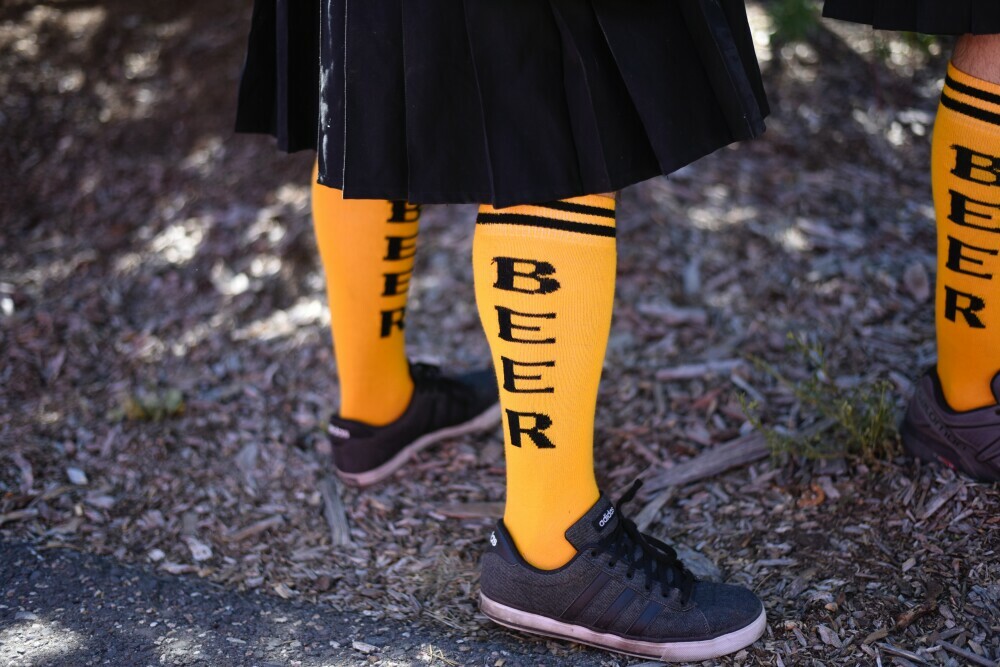 someone wearing socks that say beer on them