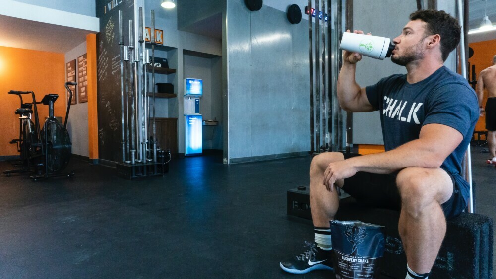 fit man drinking protein shake