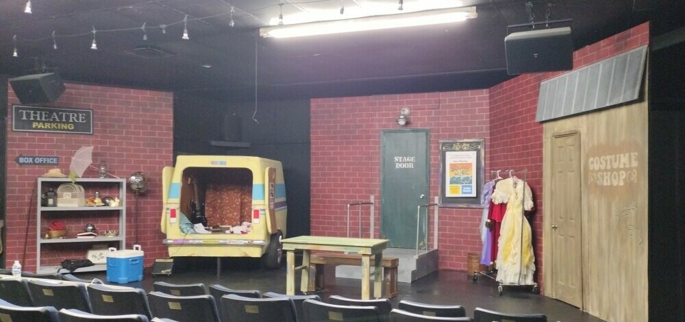 Stage Setting for Two On The Aisle, Three In A Van