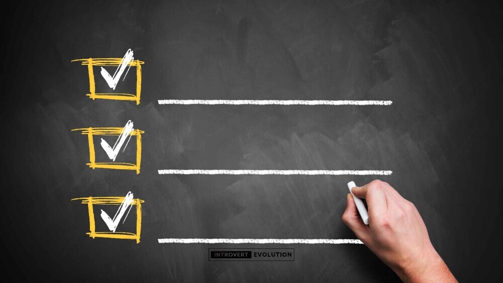 Person using visual checklist to build self-discipline with ADHD