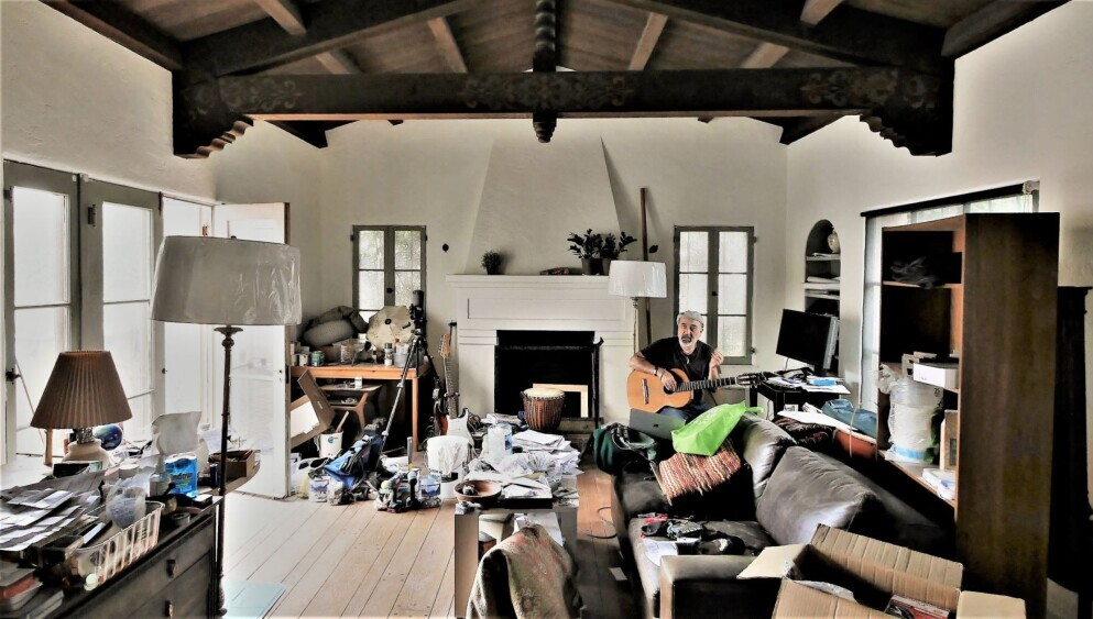 Can You Have ADHD and Be Introverted - man with guitar in messy room