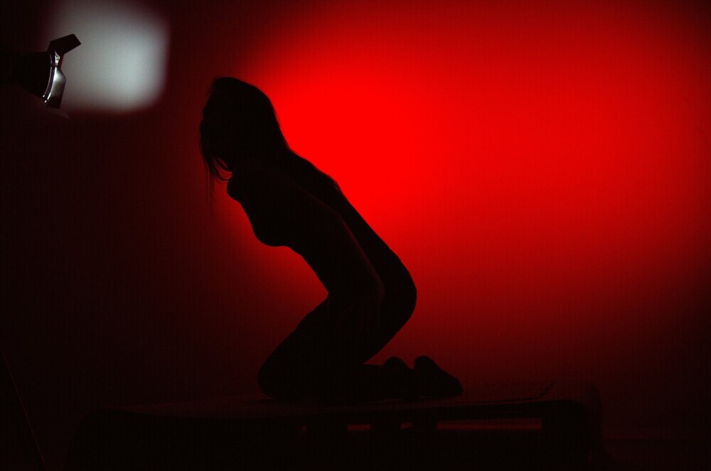 kneeling red background